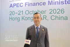 越南财政部长吴文俊接受越通社驻香港记者采访。图自越通社