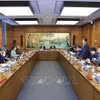 国会代表分组讨论。图自越通社