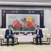 吴文俊会见重庆市市长胡衡华。图自越通社
