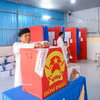 高台教信教群众兴奋地前往投票。图自越通社