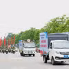 北宁省北江坊在街道上进行宣传巡游，向广大民众传播构建安全、文明交通文化的信息。图自越通社