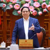 越南政府总理范明政主持会议。图自越通社