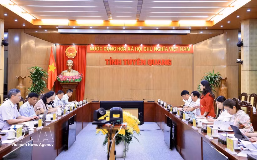 工作会谈现场。图自越通社