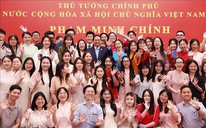 越南政府总理范明政会见旅居中国越南人社群代表。图自越通社