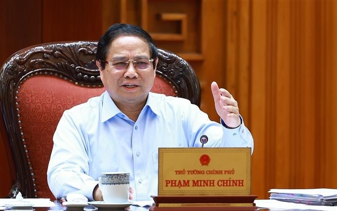 越南政府总理范明政发表讲话。图自越通社