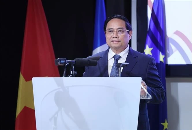 越南政府总理范明政出席越法企业论坛。图自越通社
