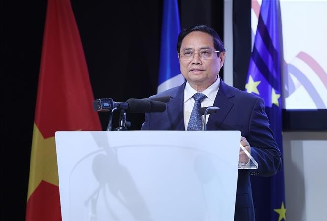 越南政府总理范明政出席越法企业论坛。图自越通社