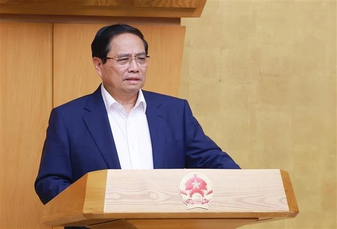 政府总理范明政在会议上发表讲话。图自越通社