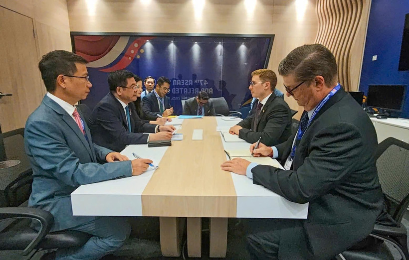 工作会谈现场。图自越通社