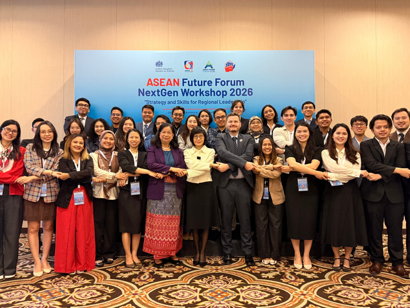 出席研讨会的代表合影。图自越通社