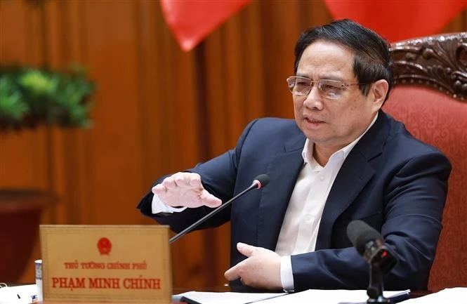 越共中央政治局委员、政府党委书记、政府总理范明政发表讲话。图自越通社