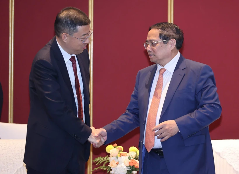 越南政府总理范明政与中国银行（BOC）董事长葛海蛟。图自越通社
