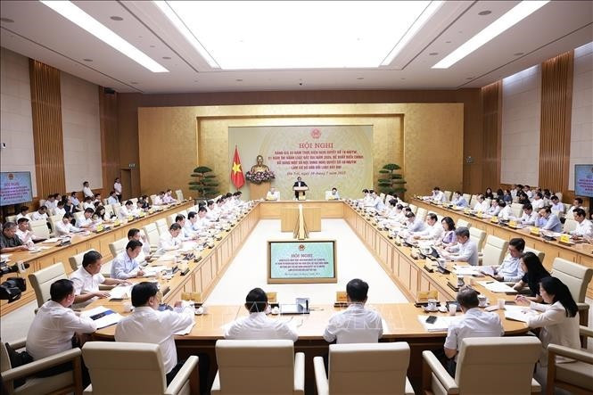 第18-NQ/TW号决议三年实施情况及2024年《土地法》一年执行成效总结会议现场。图自越通社