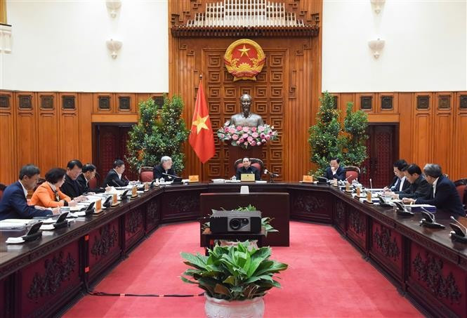 越南政府总理范明政主持召开政府组织机构调整指导委员会第九次会议。图自越通社