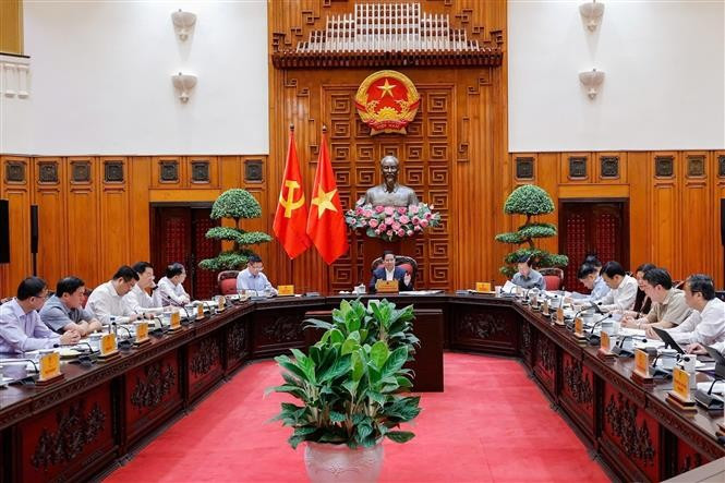 越南政府总理范明政主持召开政府常务委员会会议。图自越通社