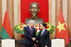 越南国家主席梁强与白俄罗斯国民会议代表院主席伊戈尔·谢尔盖延科。图自越通社