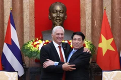 国家主席梁强会见古共中央第一书记、国家主席迪亚斯-卡内尔。图自越通社