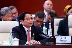 越南政府总理范明政在会上发表讲话。图自越通社