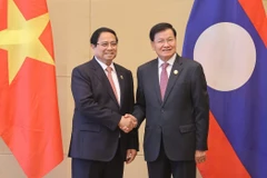 范明政总理会见老挝人民革命党中央总书记、国家主席通伦。图自越通社