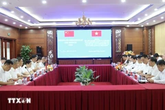 双方会谈现场。图自越通社