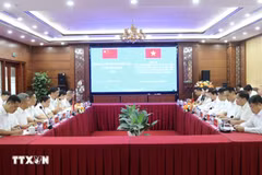 双方会谈现场。图自越通社