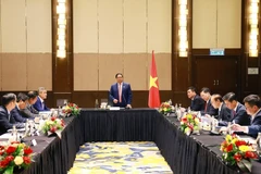 会议场景。图自越通社