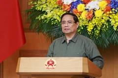 范明政在会上发言。图自越通社