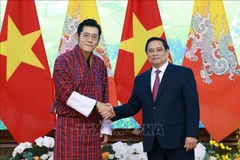 越南总理范明政会见不丹国王吉格梅。图自越通社
