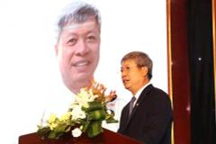 岘港市人民委员会副主席胡光宝。图自越通社