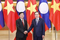越南国会主席陈青敏会见老挝人民革命党中央总书记、国家主席通伦·西苏里。图自越通社
