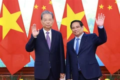 越南政府总理范明政会见中国全国人大常委会委员长赵乐际。图自越通社