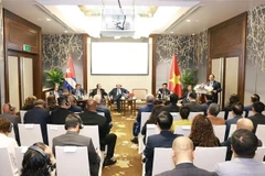 范明政在会上发表讲话。图自越通社