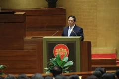 越南政府总理范明政在会上发表讲话。图自越通社