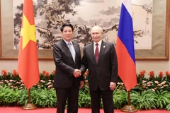 越南国家主席梁强会见俄罗斯总统普京。图自越通社