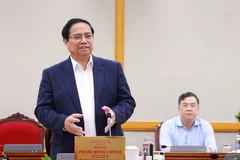 范明政总理在会上发表讲话。图自越通社
