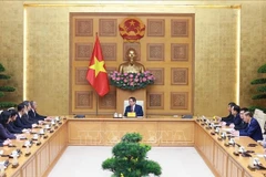 越南政府总理范明政会见中国山东省省委书记林武。图自越通社