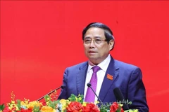 政府总理范明政主持会议。图自越通社