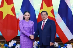 越南政府总理范明政与泰国总理共同主持召开第四次越泰联合内阁会议。图自越通社