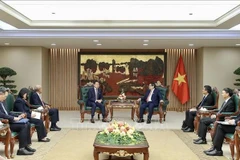 越南政府总理范明政会见世界知识产权组织总干事邓鸿森。图自越通社