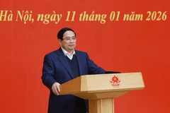 越共中央政治局委员、政府党委书记、政府总理范明政在会议上发表讲话。图自越通社