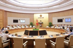 政府7月立法工作会议。图自越通社