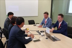 座谈会期间举行的双边贸易促进活动。图自越通社