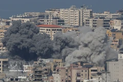 2026年3月4日，以色列空袭黎巴嫩贝鲁特以南的哈雷特·赫雷克后，浓烟升起。图自新华社/越通社