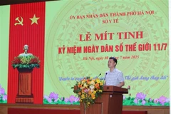 卫生部人口司司长黎青勇在会议上发言。图自越通社