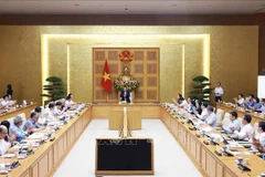 会议场景。图自越通社
