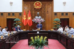 越南政府总理范明政在会议上发表讲话。图自越通社