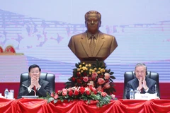 越共中央总书记苏林与老挝人民革命党中央总书记、国家主席通伦·西苏里主持召开越南共产党第十四次全国代表大会成果通报会。图自越通社