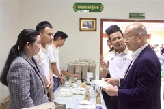 越柬企业参加商品推广活动。图自越通社