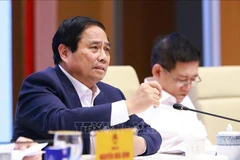 越南总理范明政在会议上发表讲话。图自越通社
