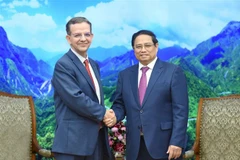 越南政府总理范明政在河内会见了以保罗·梅达斯（Paulo Medas）先生为首的国际货币基金组织（IMF）工作代表团 图自越通社